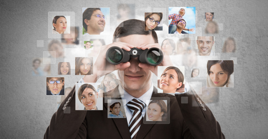Business man looking for employees through binoculars. Lots of p